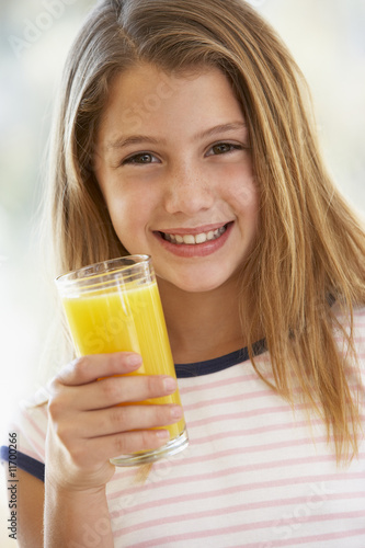 Young Girl Drinking Orange Juice