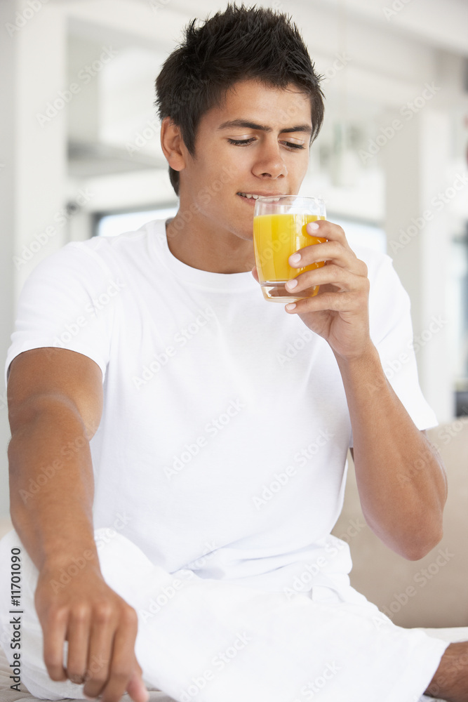 Young Man Drinking Orange Juice Young Man Drinking Orange Juice