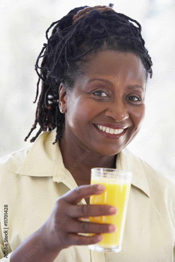 Senior Woman Drinking Fresh Orange Juice Senior Woman Drinking Fresh Orange Juice