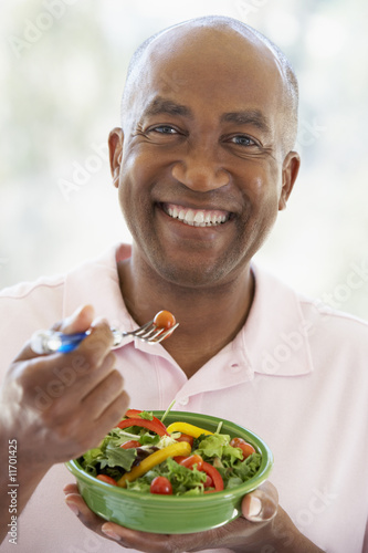 Middle Aged Man Eating Salad