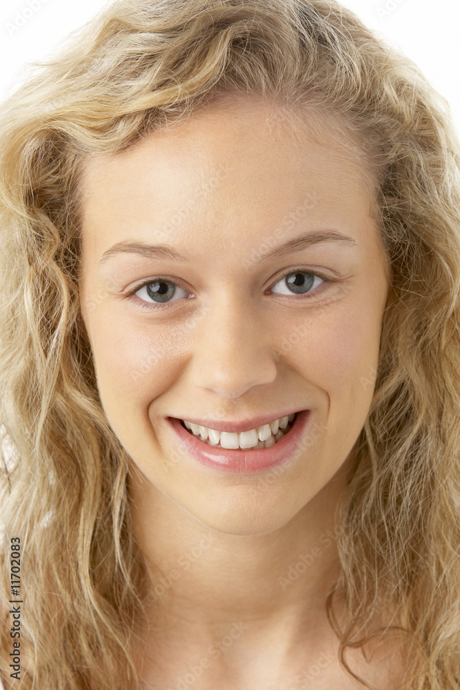 Portrait Of Young Woman Smiling At The Camera Portrait Of Young Woman Smiling At The Camera