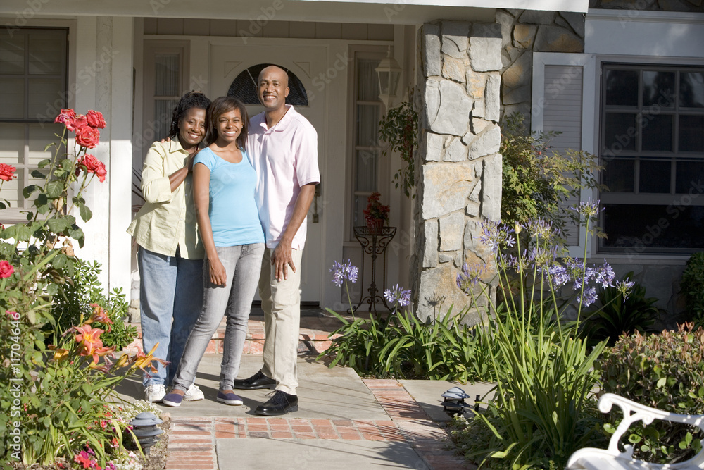 Family Standing Outside Their House Family Standing Outside Their House