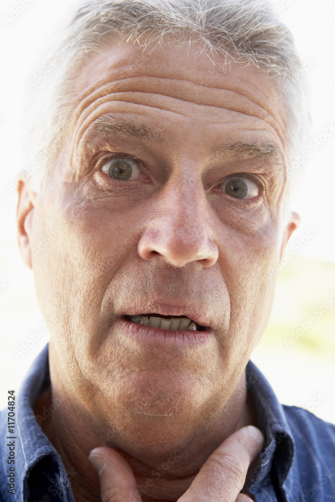 Portrait of Senior Man Looking Shocked Portrait of Senior Man Looking Shocked