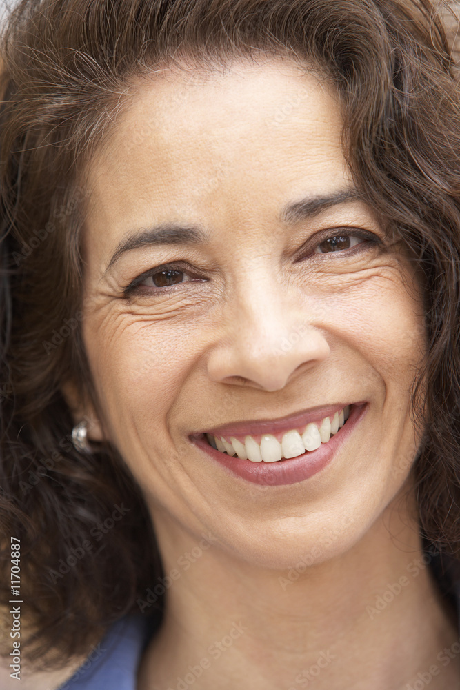 Portrait Of Middle Aged Woman Smiling At Camera Portrait Of Middle Aged Woman Smiling At Camera