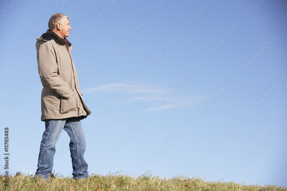 Senior Man Standing In Park