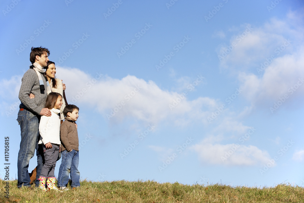 Family Standing In The Park