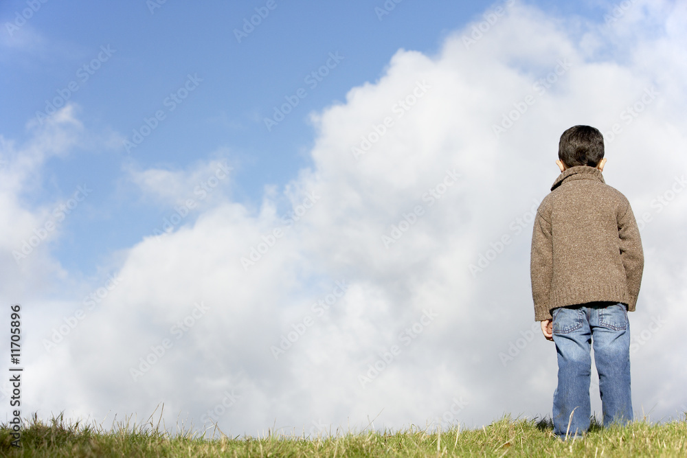 Young Boy Standing In The Park