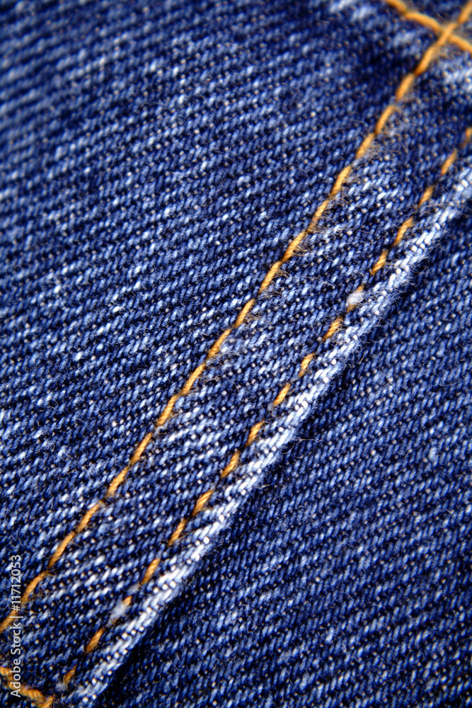 Closeup of stitching of denim jeans Closeup of stitching of denim jeans