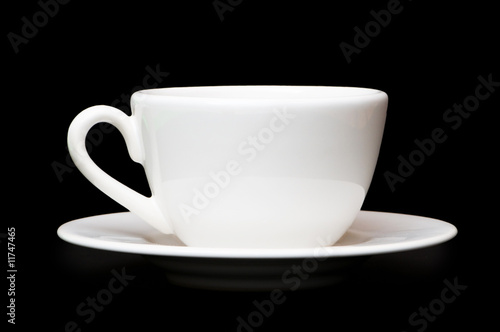 White tea cup isolated on black background