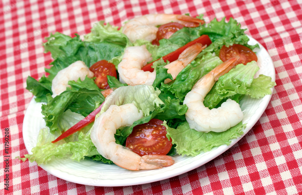 Whole shrimp seafood salad with greens and tomatoes. Whole shrimp seafood salad with greens and tomatoes.