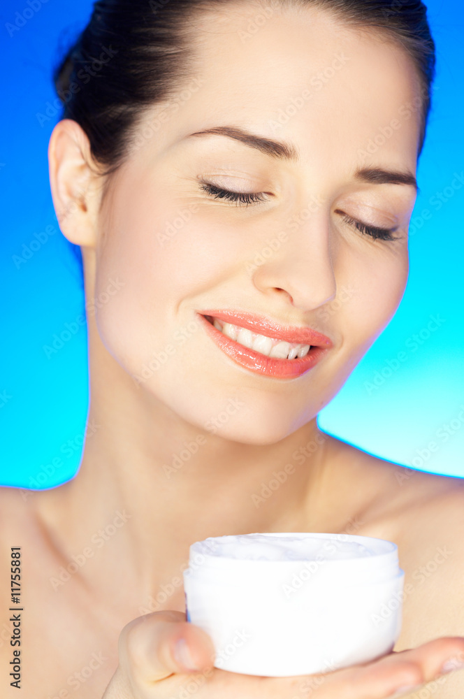 Portrait of 20-25 years old beautiful woman with cream Portrait of 20-25 years old beautiful woman with cream