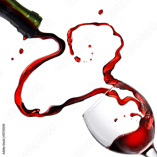 Heart from pouring red wine in goblet isolated on white #11759204