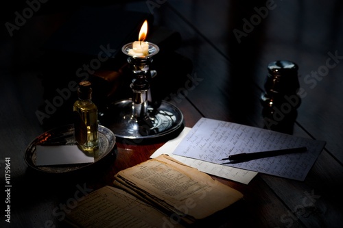 writing a letter by candlelight