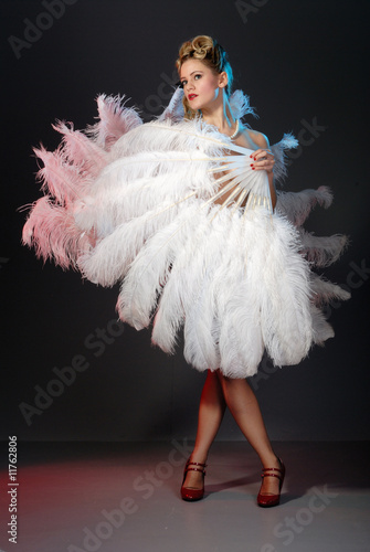 Burlesque artist with ostrich feather fan