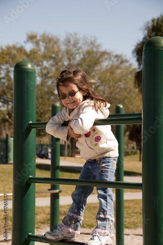 Girl Climbing on Frame at park
