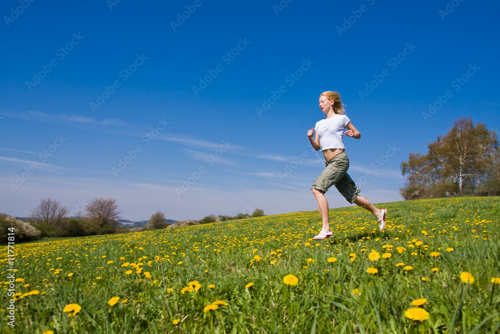young female having fun on flowery meadow young female having fun on flowery meadow