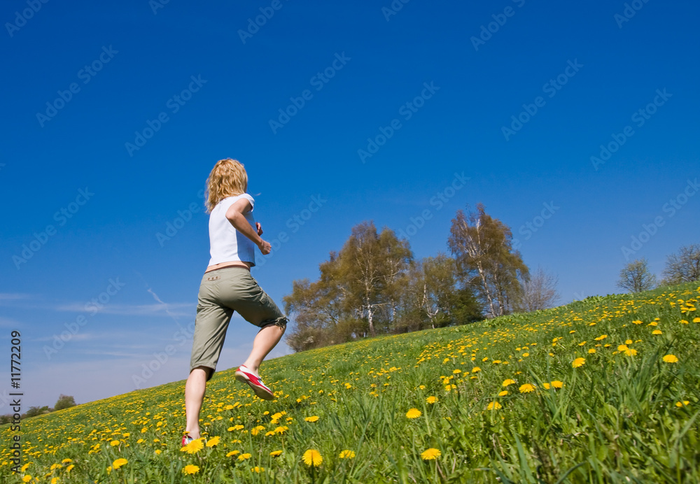 young female having fun on flowery meadow young female having fun on flowery meadow