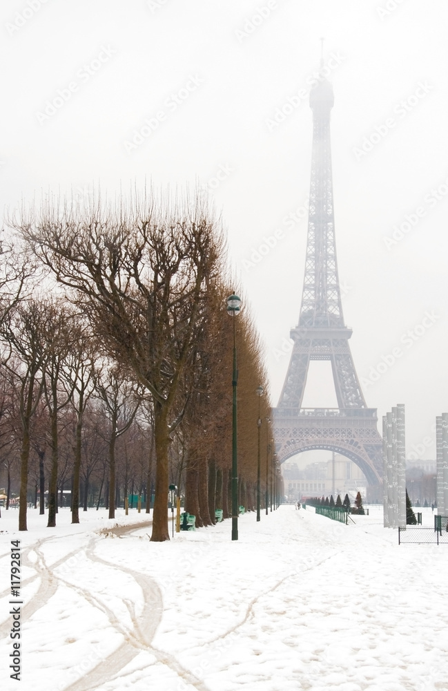 Snowy day in Paris - misty Eiffel Tower and lots of snow
