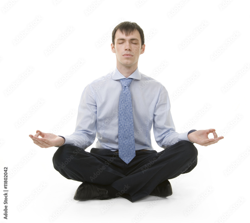 Businessman is sitting in yoga position Businessman is sitting in yoga position