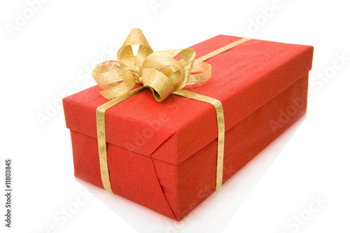 red gift box over white background with gold ribbon
