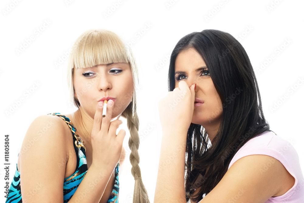 two friends one of which smokes a cigarette two friends one of which smokes a cigarette