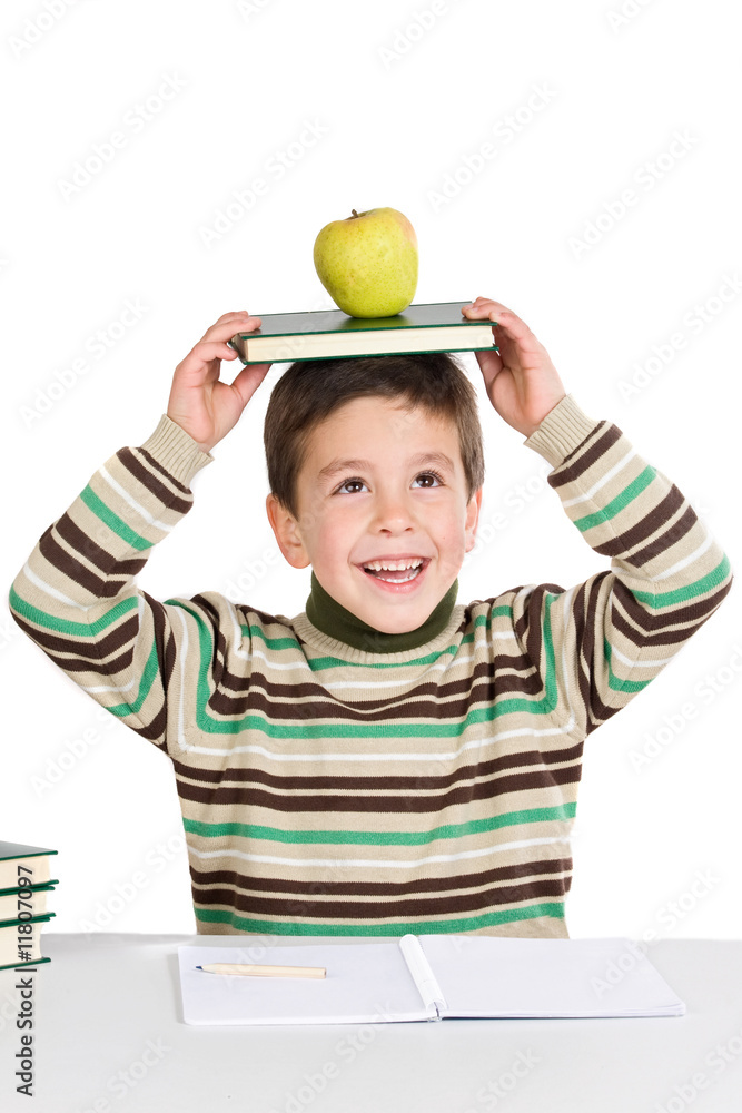 Adorable child studying with books and apple in the head Adorable child studying with books and apple in the head