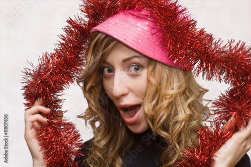 Blonde crazy girl with pink hat and red tinsel