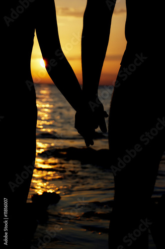 Silhouette in love on sunset