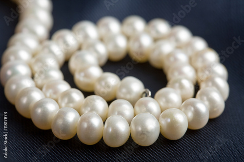 pearl necklace over dark background