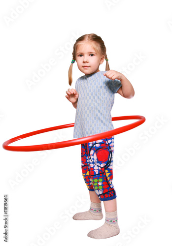 Obraz na płótnie The girl rotates a gymnastic hoop w salonie