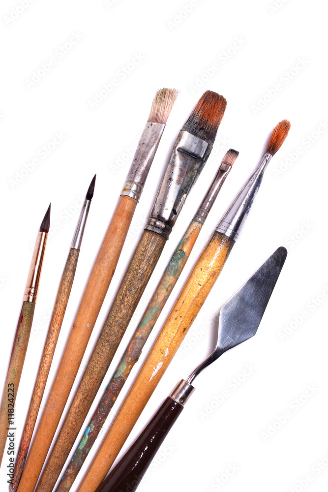 Obraz premium paintbrushes and palette knife on white