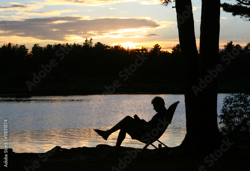 Reading Man Silhouetted at Sunset