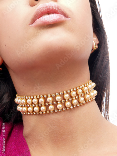 young beautiful lady with a precious pearl necklace