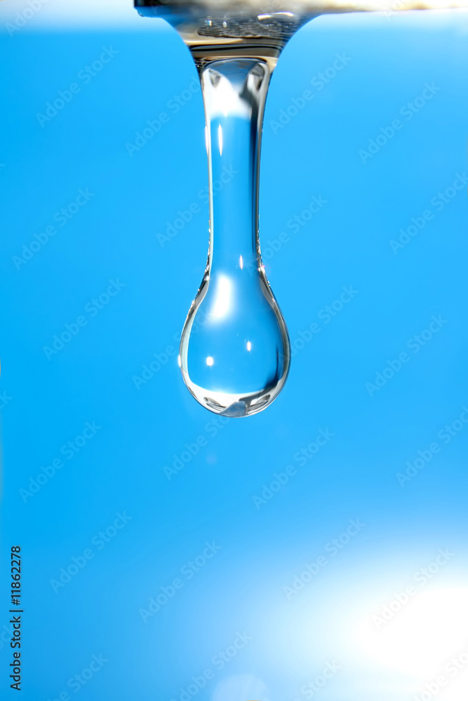 Drop of pure water on shiny background.