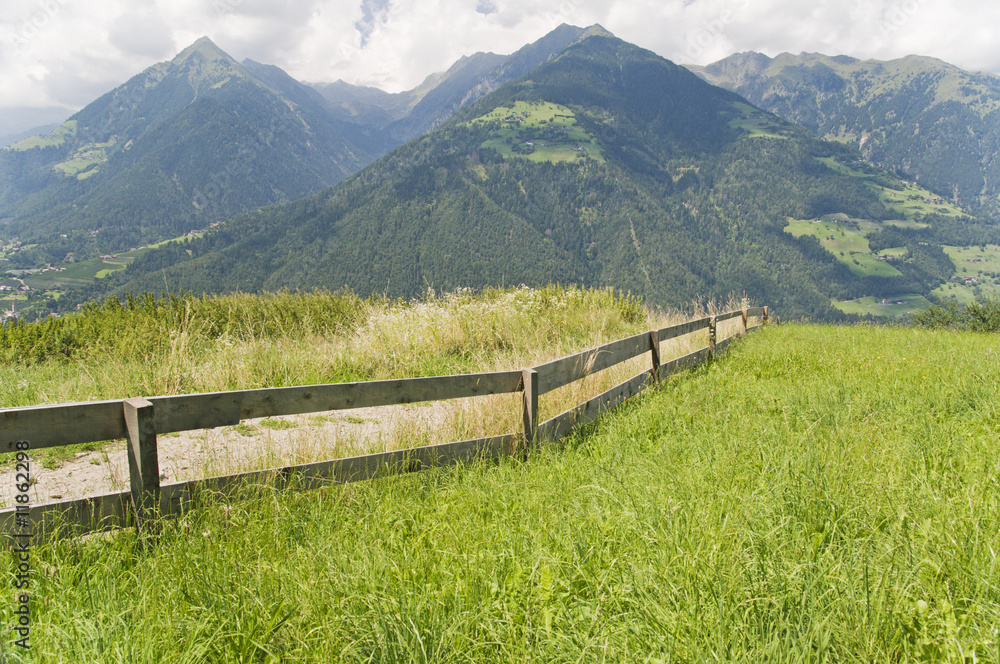 wooden fence with mountains