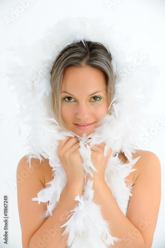 beautiful young woman with white feathers