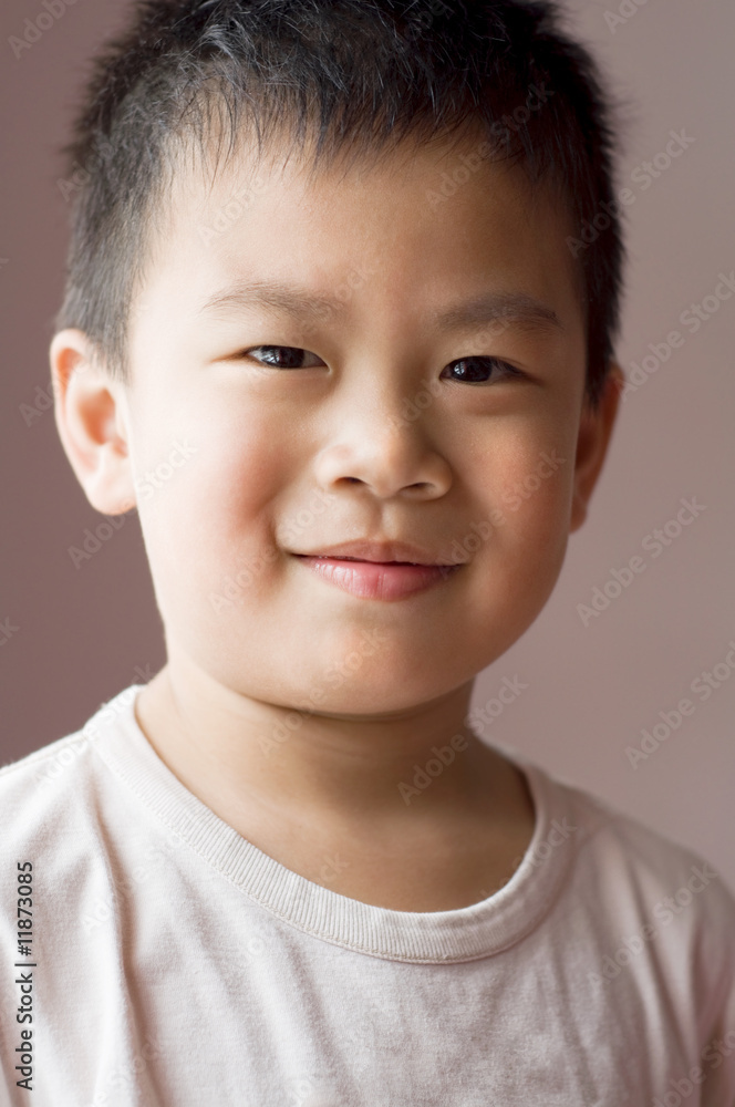 Photo of Asian young boy looking at camera Photo of Asian young boy looking at camera