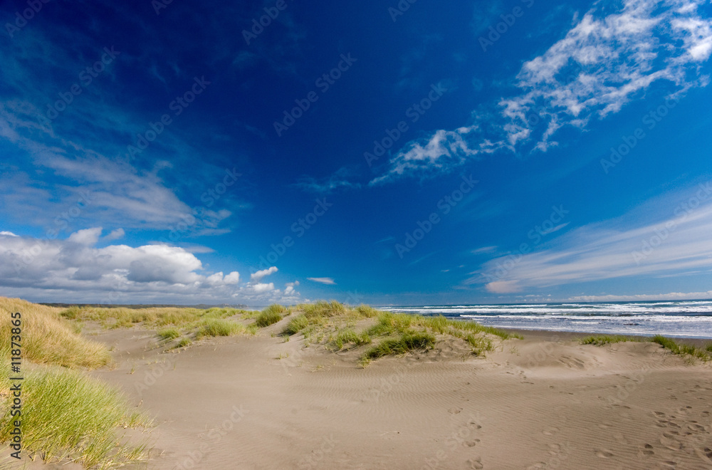 Sand dunes on blue sky background