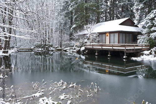 Japanese tea house winter with pond in foreground