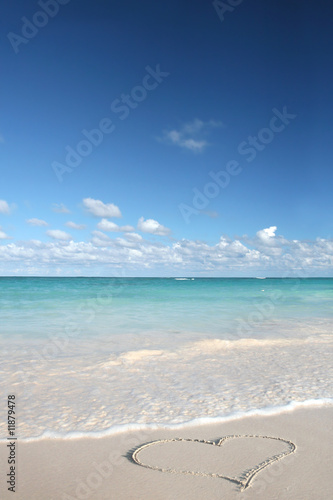 Heart on Beach Sand in Tropical Paradize: White Sand Beach and G photo