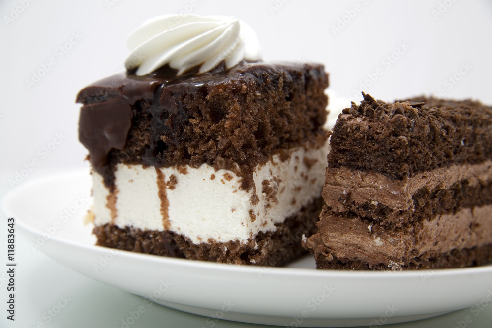 Two chocolate cakes on white background