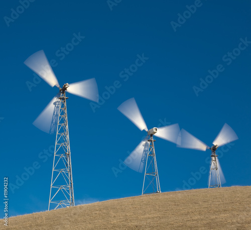 windmills against blue sky