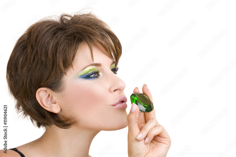 beautiful woman with green emerald in her hand