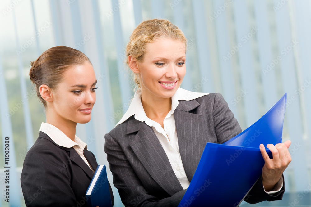 Two businesspeople working together at office Two businesspeople working together at office