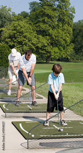 Family Practicing Golf