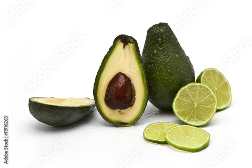 avocados and limes on white background