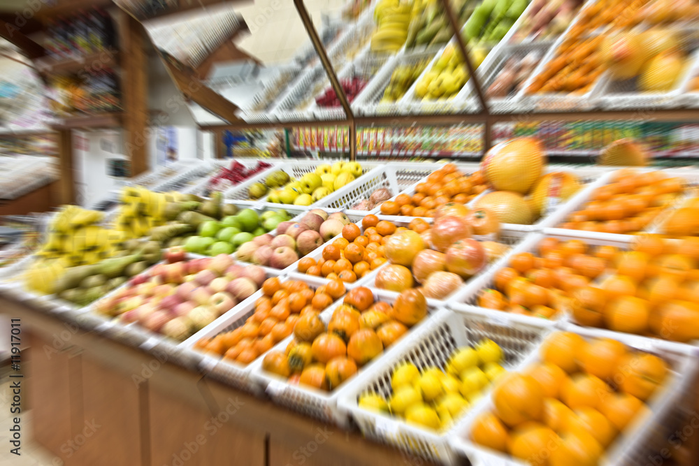 A shot of fruit and vegetables section in a grocery store. Blur