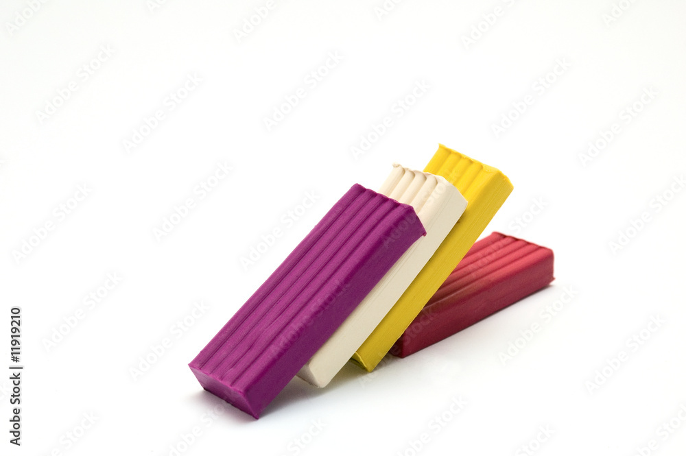 Fototapeta premium Brick of plasticine on a white background