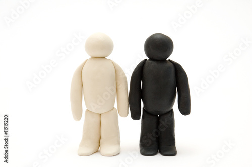 Two Plasticine men. standing isolated on white background