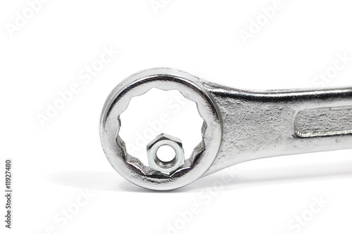 Fotografía Wrong tool: big wrench with little nut. Competence concept.